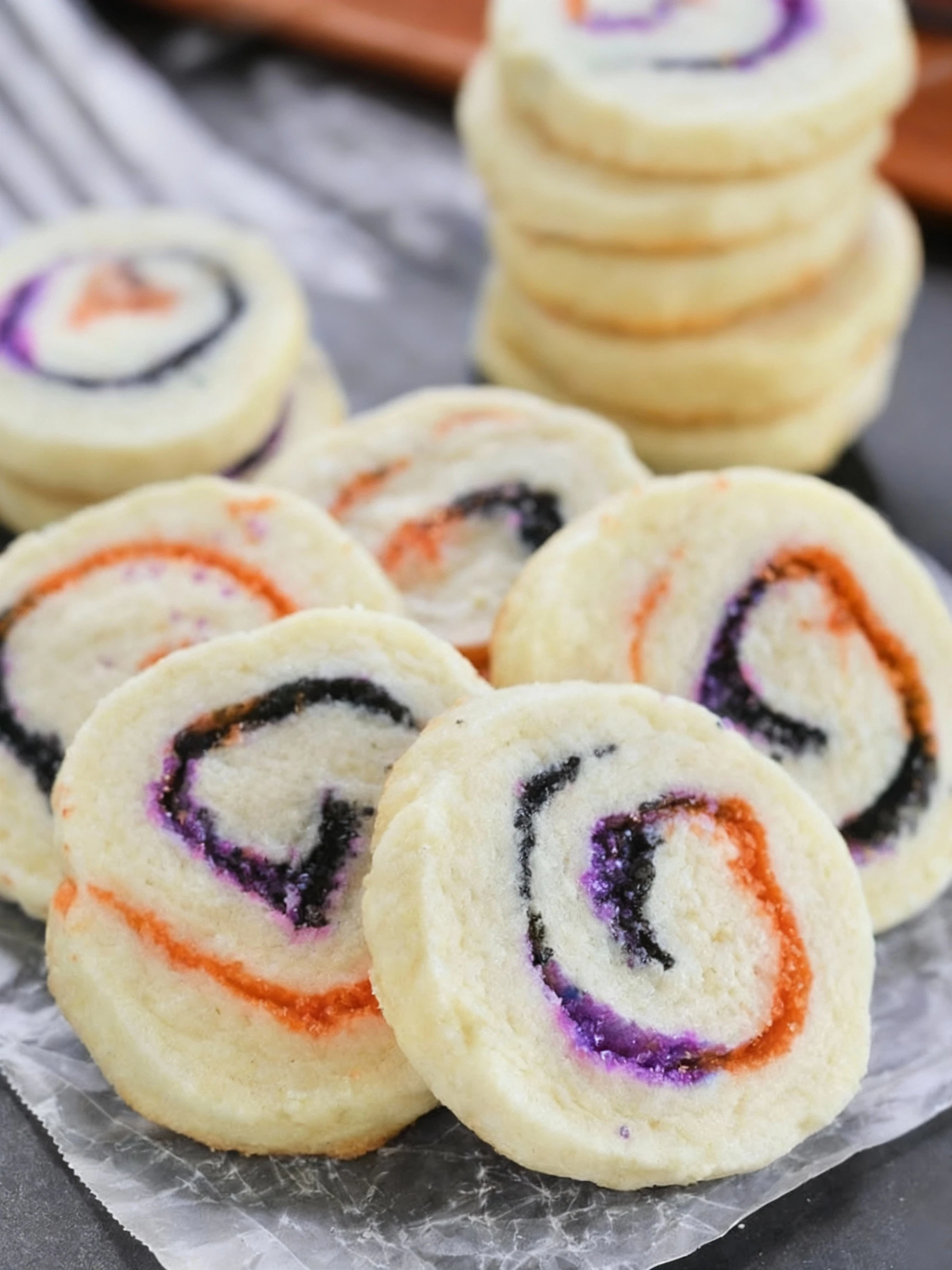 Fun and festive Spiral Halloween Cookies are buttery, melt-in-your-mouth sugar cookies swirled with colored sugar finished