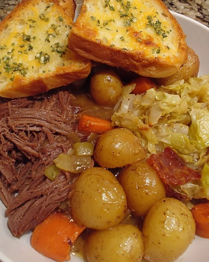 Homestyle Pot Roast with Baby Potatoes, Cabbage, and Cheesy Garlic Toast finished