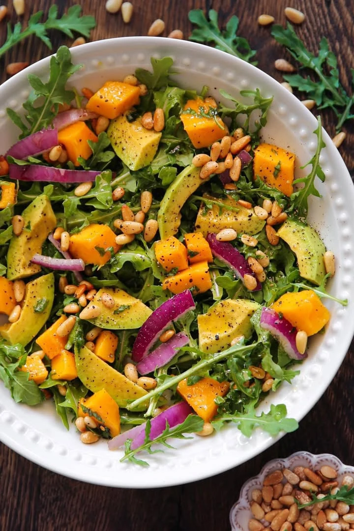 Avocado Mango Salad with Arugula, Pine Nuts, and Honey-Lime Dressing finished