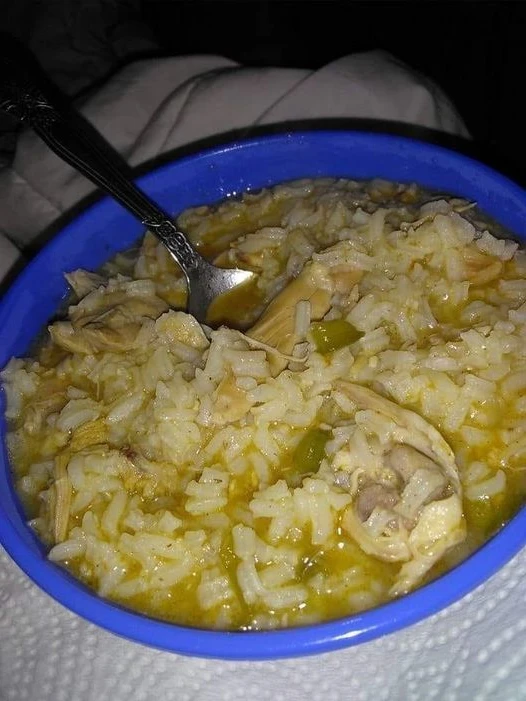 Boil chicken in rice Chicken thighs boiled with onions, bell pepper, seasoning finished