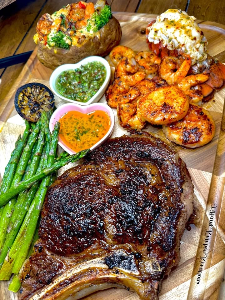 Recipe Title: Cowboy ribeye, scallops, shrimp, lobster, loaded potato, asparagus with cowboy butter and chimichurri finished