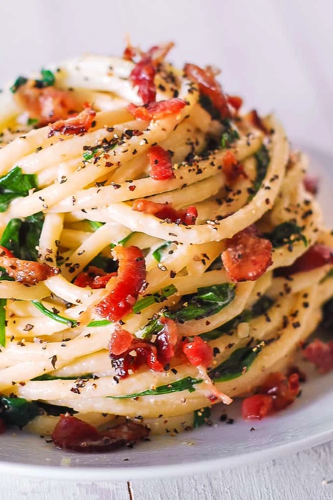 Creamy Italian Pasta with Spinach, Bacon, Buttery Garlic Parmesan Sauce, and coarsely ground black pepper. Done in 30 minutes finished