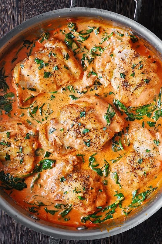 ONE-PAN, 30-MINUTE Skinless, Boneless Chicken Thighs with Creamy Tomato Basil Spinach Sauce and grated Parmesan. LOW-CARB, HIGH-PROTEIN, GLUTEN-FREE. finished
