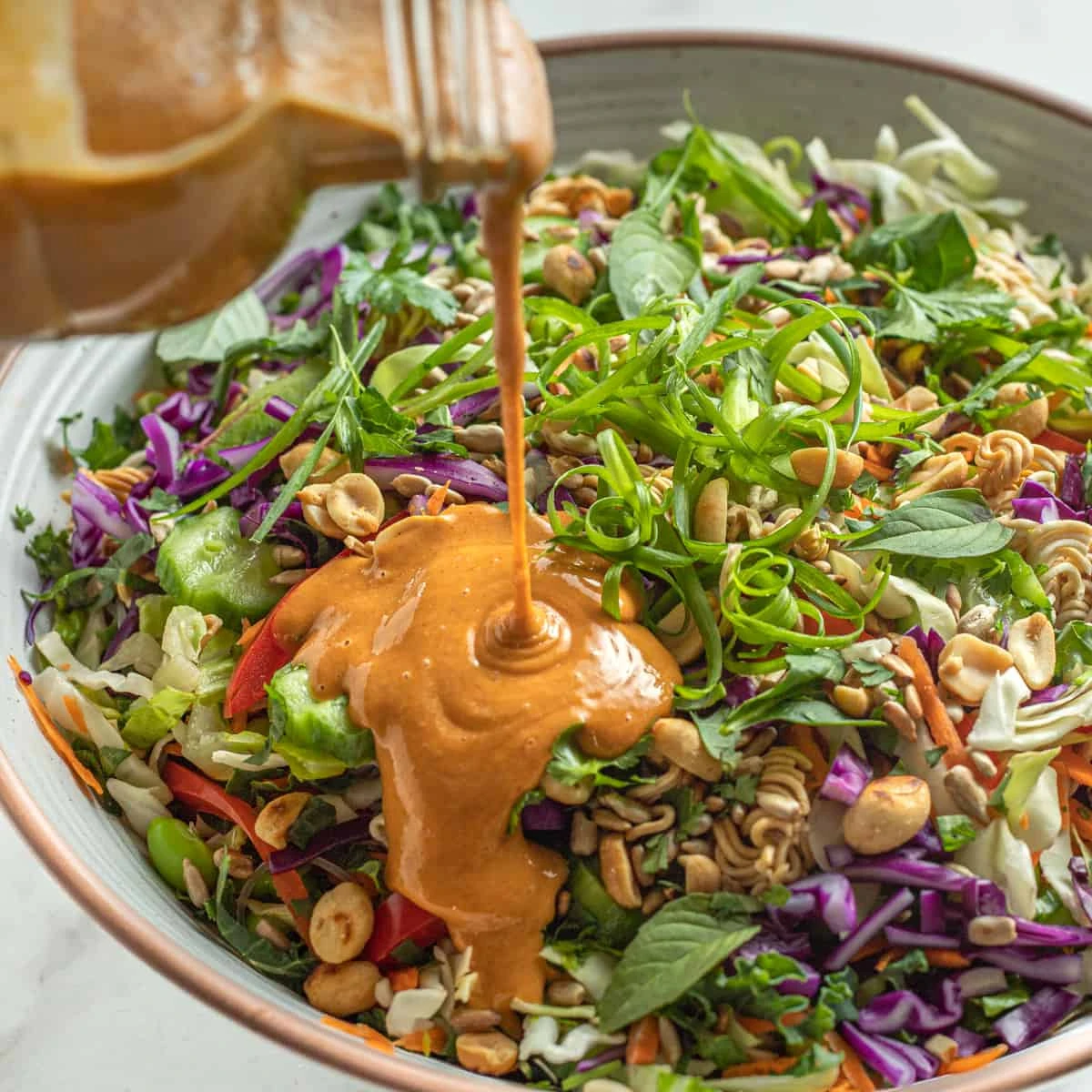 Easy to make Thai crunch salad with spicy peanut ginger sauce finished