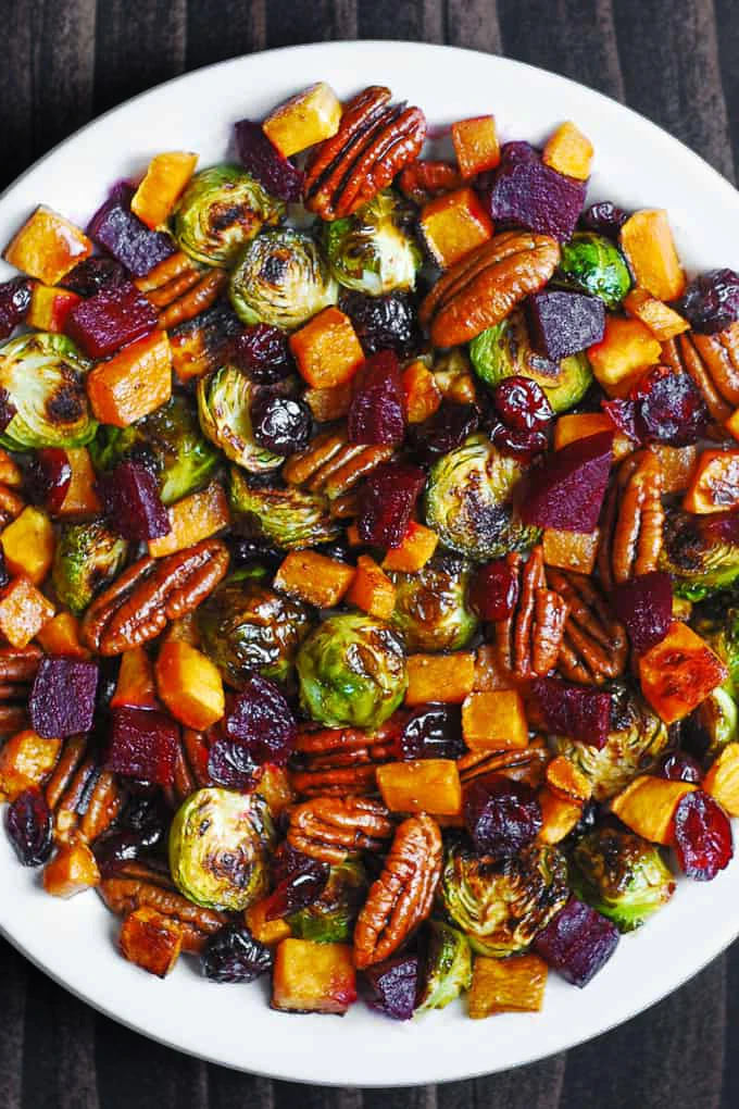 Roasted Vegetable Salad with Brussels Sprouts, Sweet Potatoes or Butternut Squash, Beets, Pecans, and dried Cranberries finished