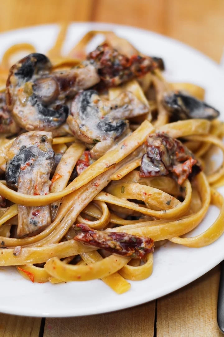 Sun-Dried Tomato and Mushroom Pasta in a Garlic and Basil Cream Sauce finished