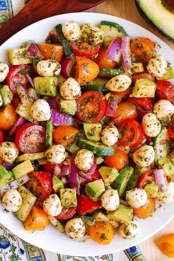 Tomato Cucumber Avocado Salad with Mozzarella and Basil Pesto finished